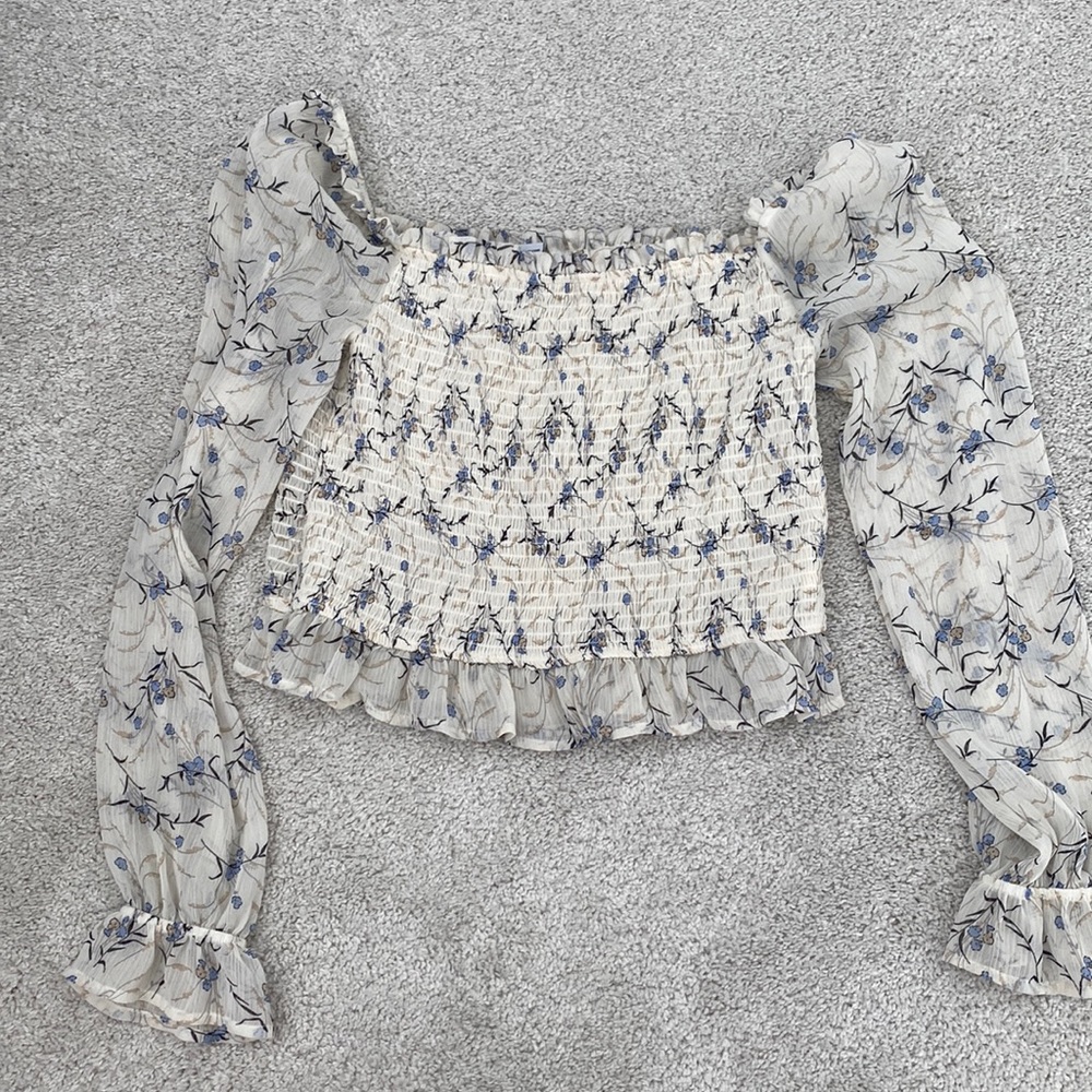 Floral shirt off the shoulder or on the shoulder depending how you want to wear